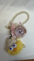 Yellow toy and purple preserved flower keychain