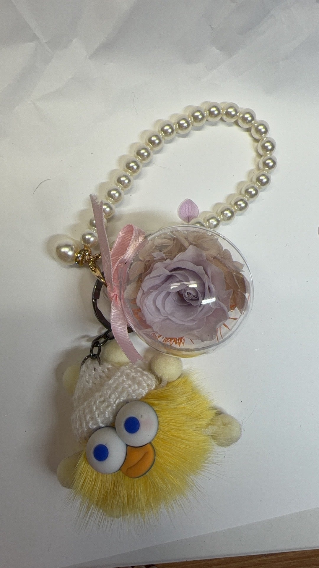 Yellow toy and purple preserved flower keychain